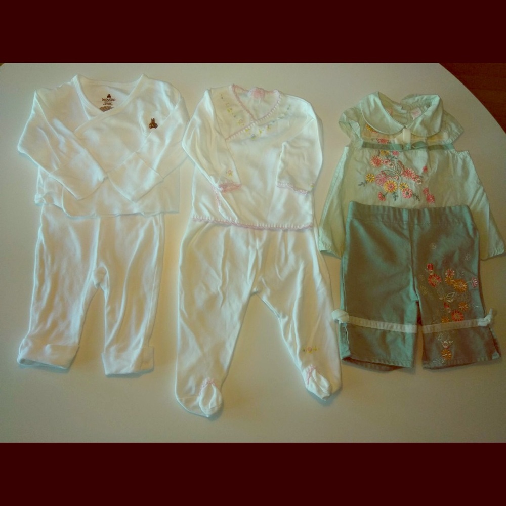 Three 0-3 Months adorable two-piece outfits.